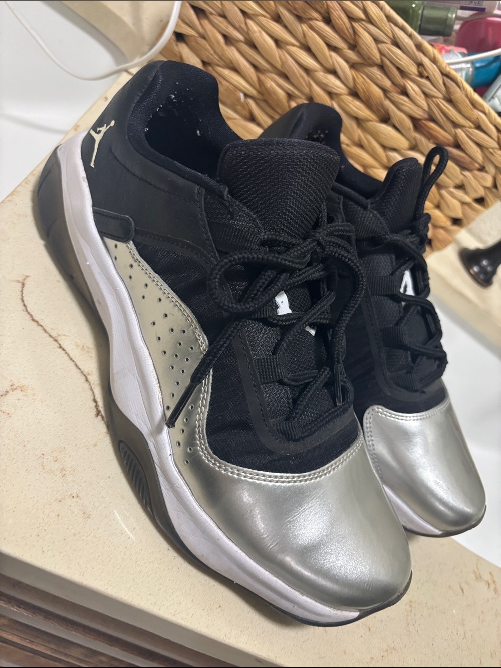 Nike Jordans Black and Silver Low-Top basketball shoes